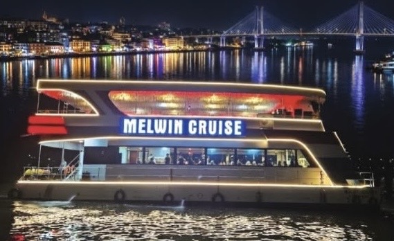 Family cruise boat on the Mandovi at night
